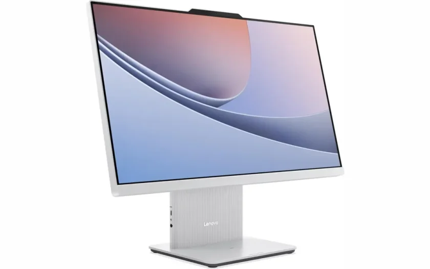 Lenovo allt-i-ett-dator med vit ram och piedestal-stöd. Skärmen visar abstrakt bakgrund med mjuka former i rosa, lila och blått.